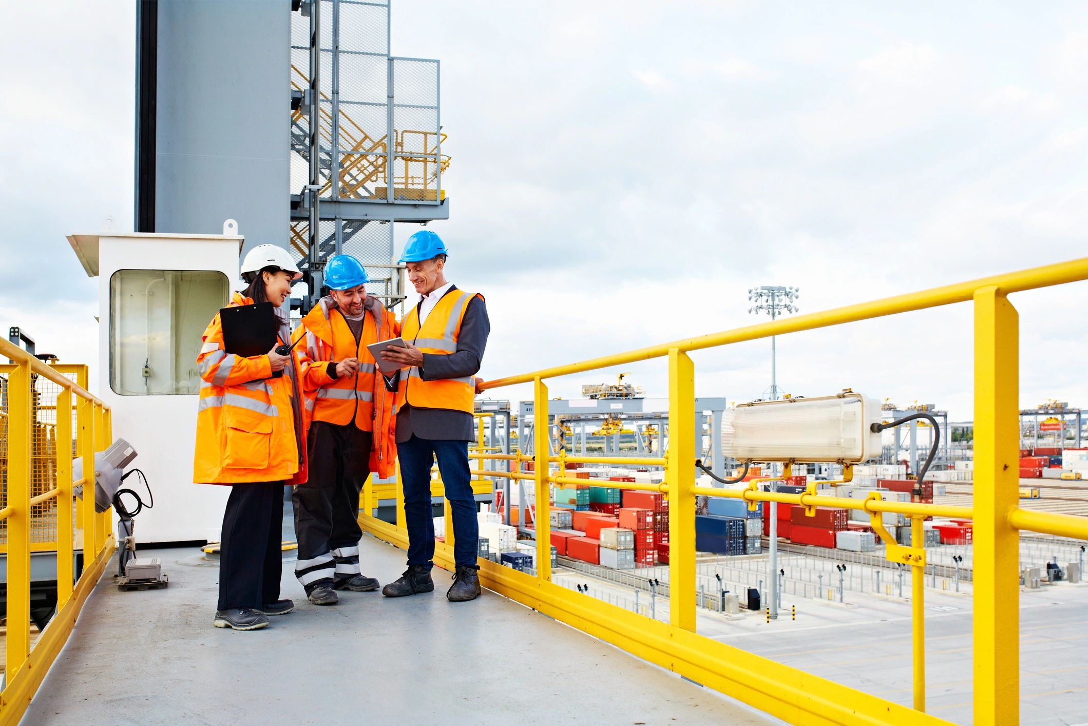 Port workers coordinating crew transfer arrangements