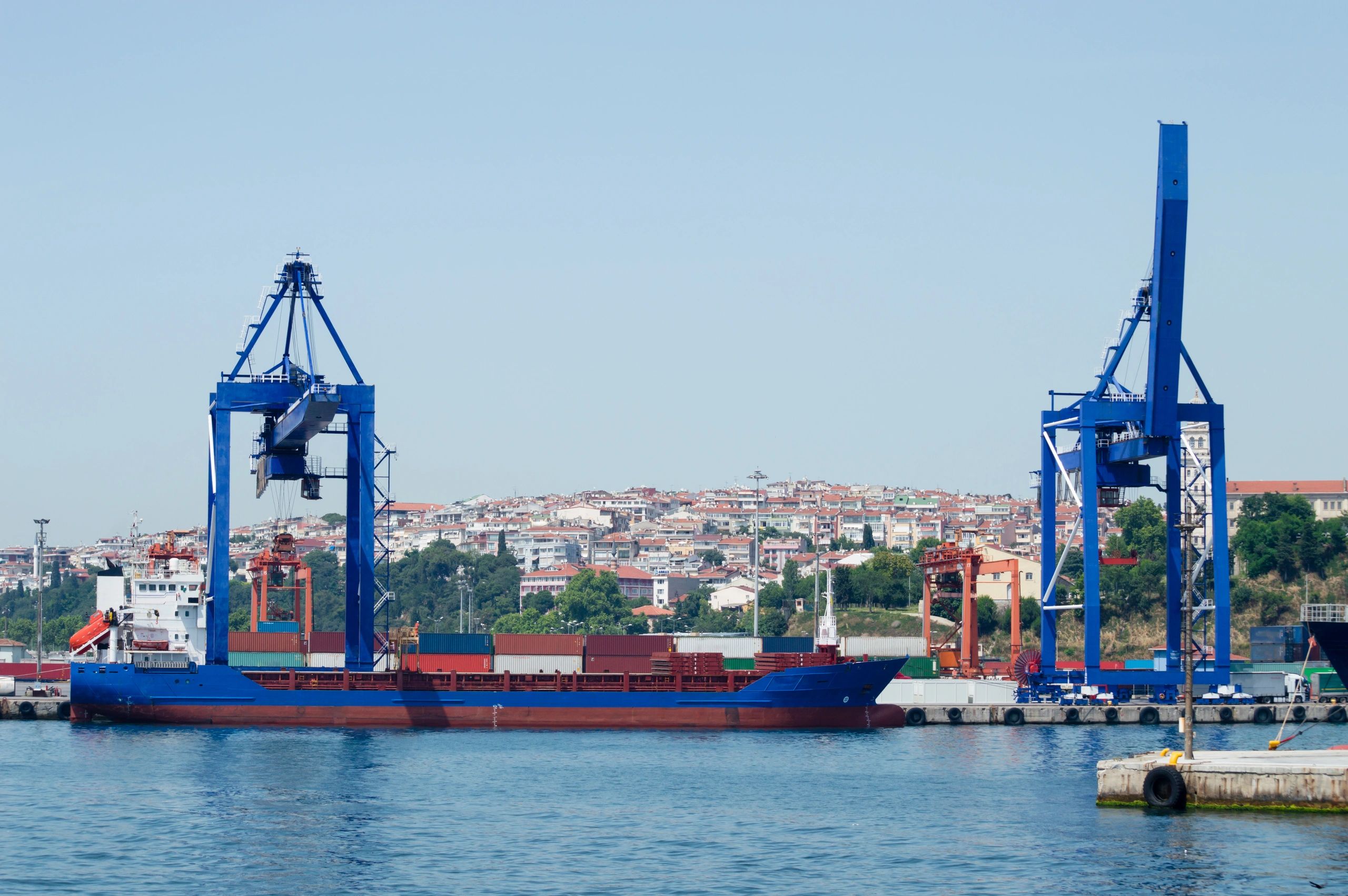 Port cranes and maritime infrastructure supporting vessel operations